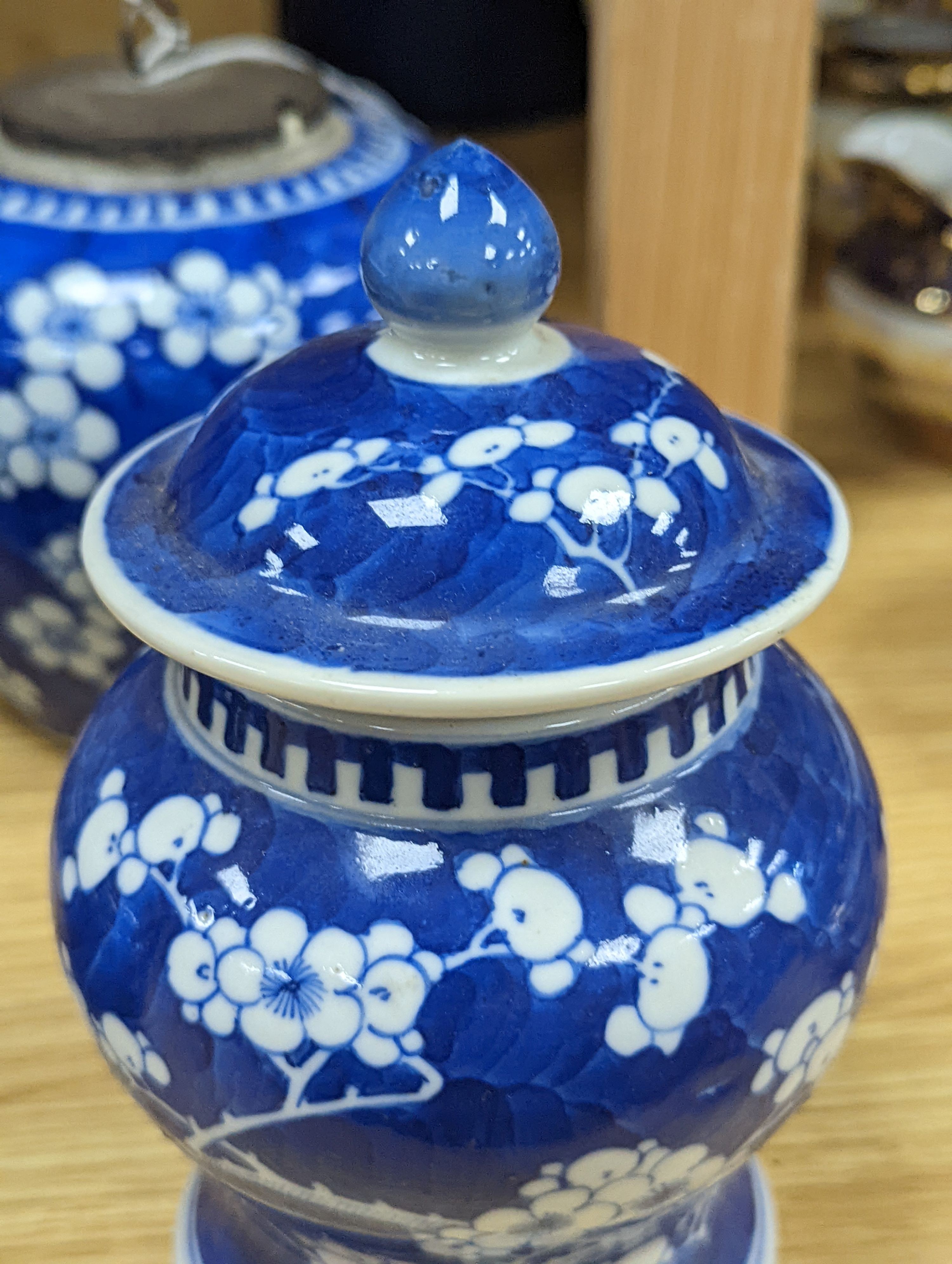Three Chinese blue and white prunus decorated jars and covers, 19th/20th century, with four character marks 18cm